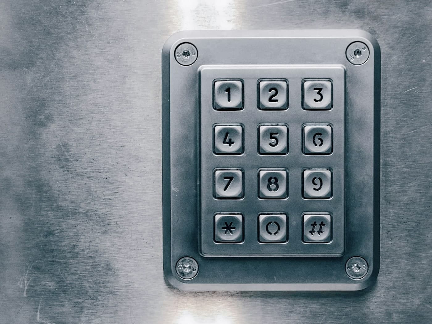 Close view of a brushed steel weatherproof entry keypad