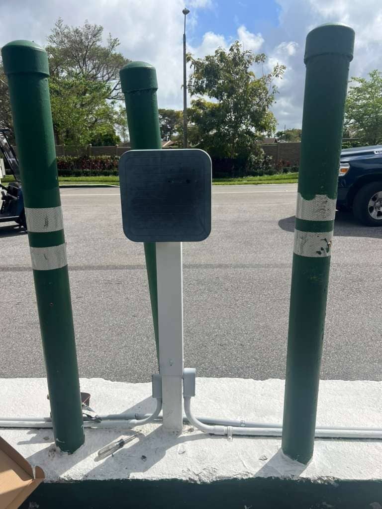 RFID reader post part-installed between bollards with the wiring still open