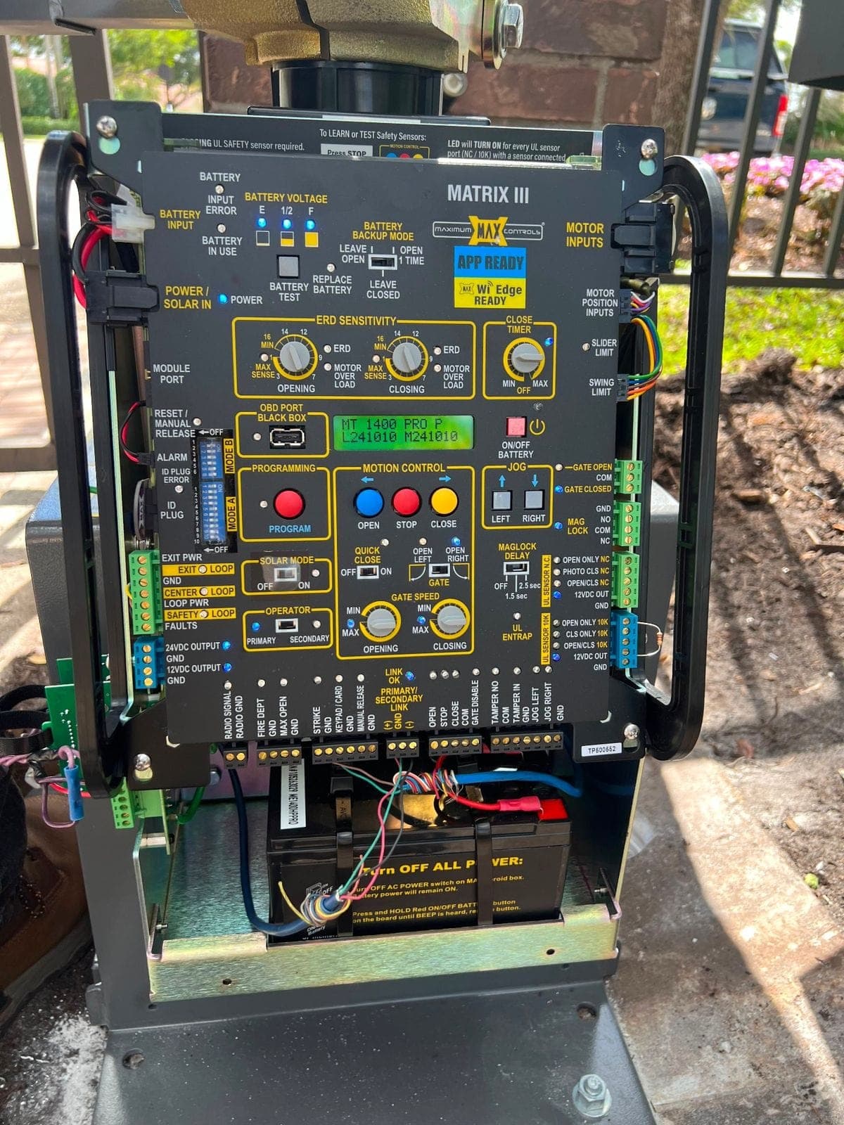 Operator control board wired in its cabinet with the door open on site